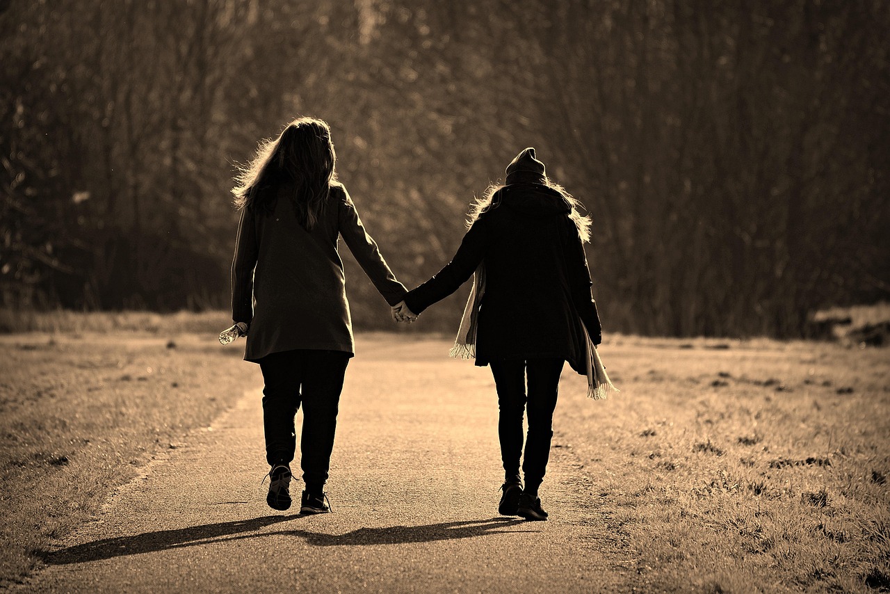 Woman, girl, friends, pair, walking, hand in hand, side by side, together, togetherness, friendship, emotion, sharing, path, countryside, walk, back light, editorial, sharing, sharing, sharing, sharin