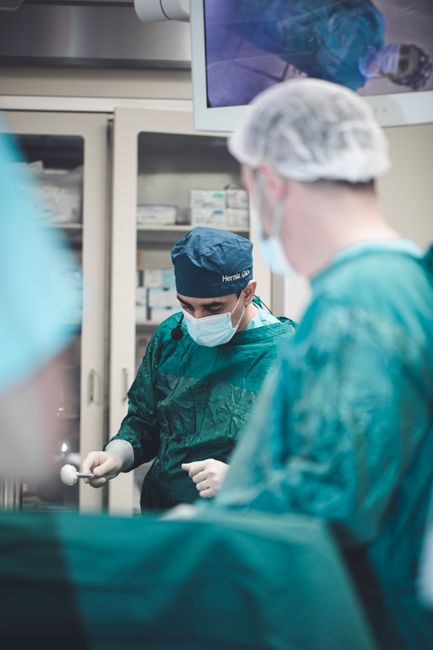 Doctors in surgical gear focus on a medical operation in a Baku clinic, Azerbaijan.