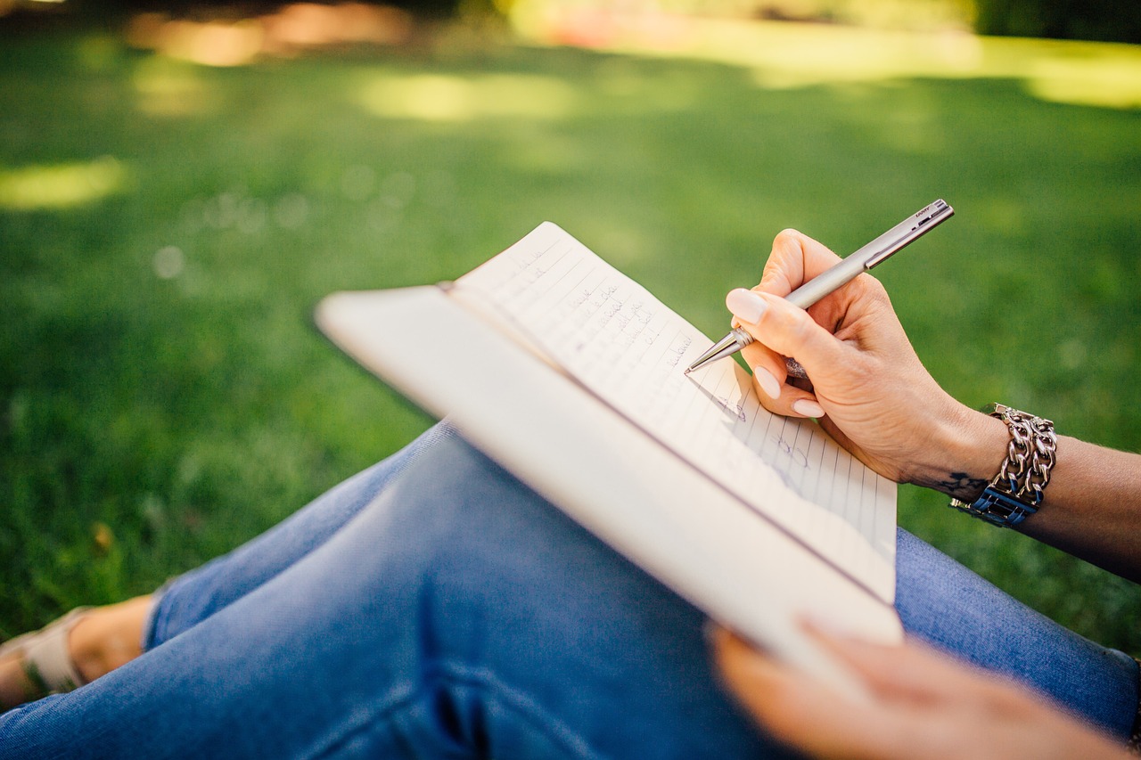 Writing, writer, notes, nature, pen, notebook, book, girl, woman, people, hands, grass, outdoors