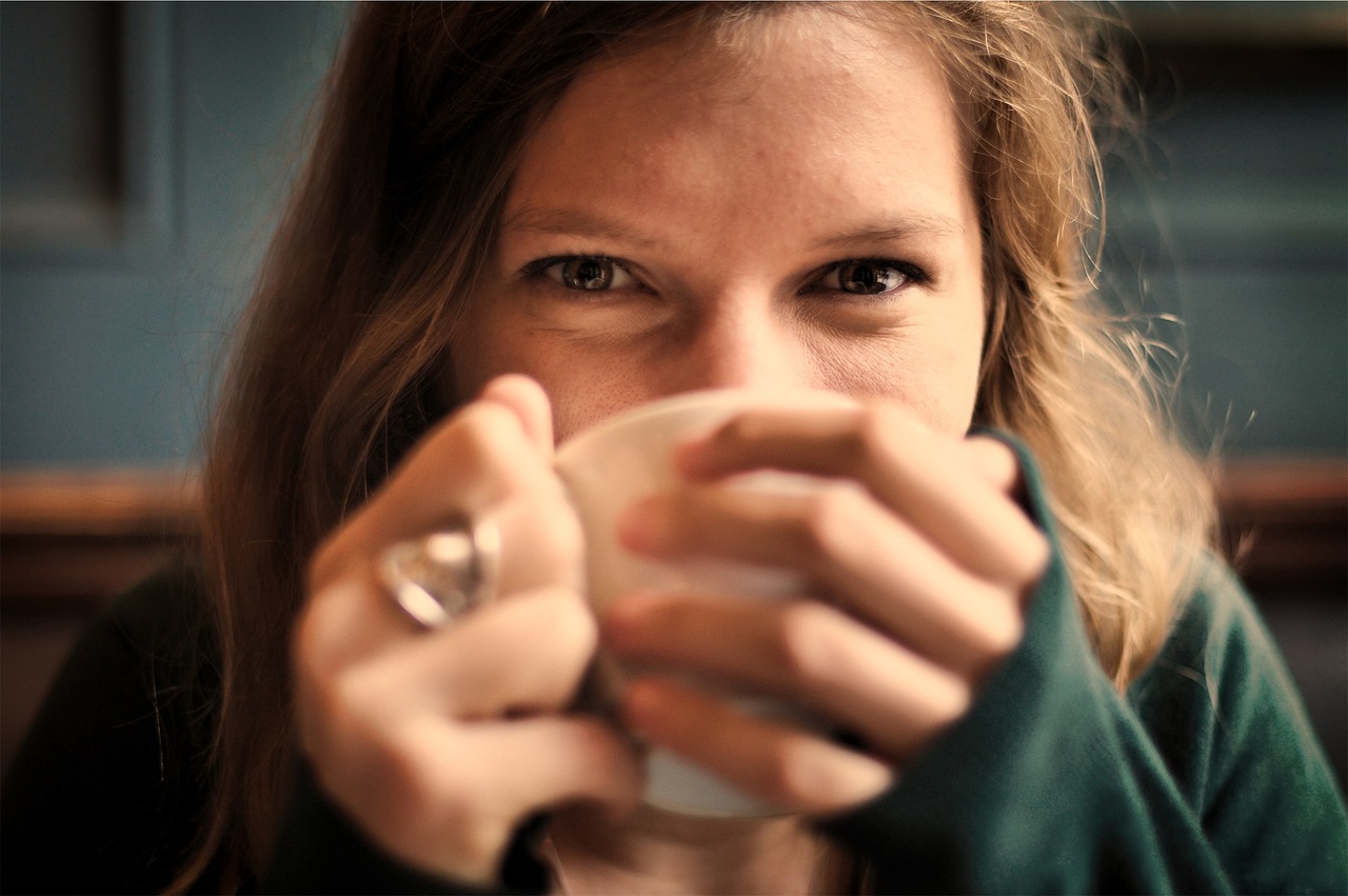 Girl, woman, smile, smiling, happy, coffee, tea, tea cup, cup, drinking, coffee cup, eyes, people, cozy, comfortable, relaxed, sipping, brown coffee, brown happy, brown relax, brown tea, brown smile, 
