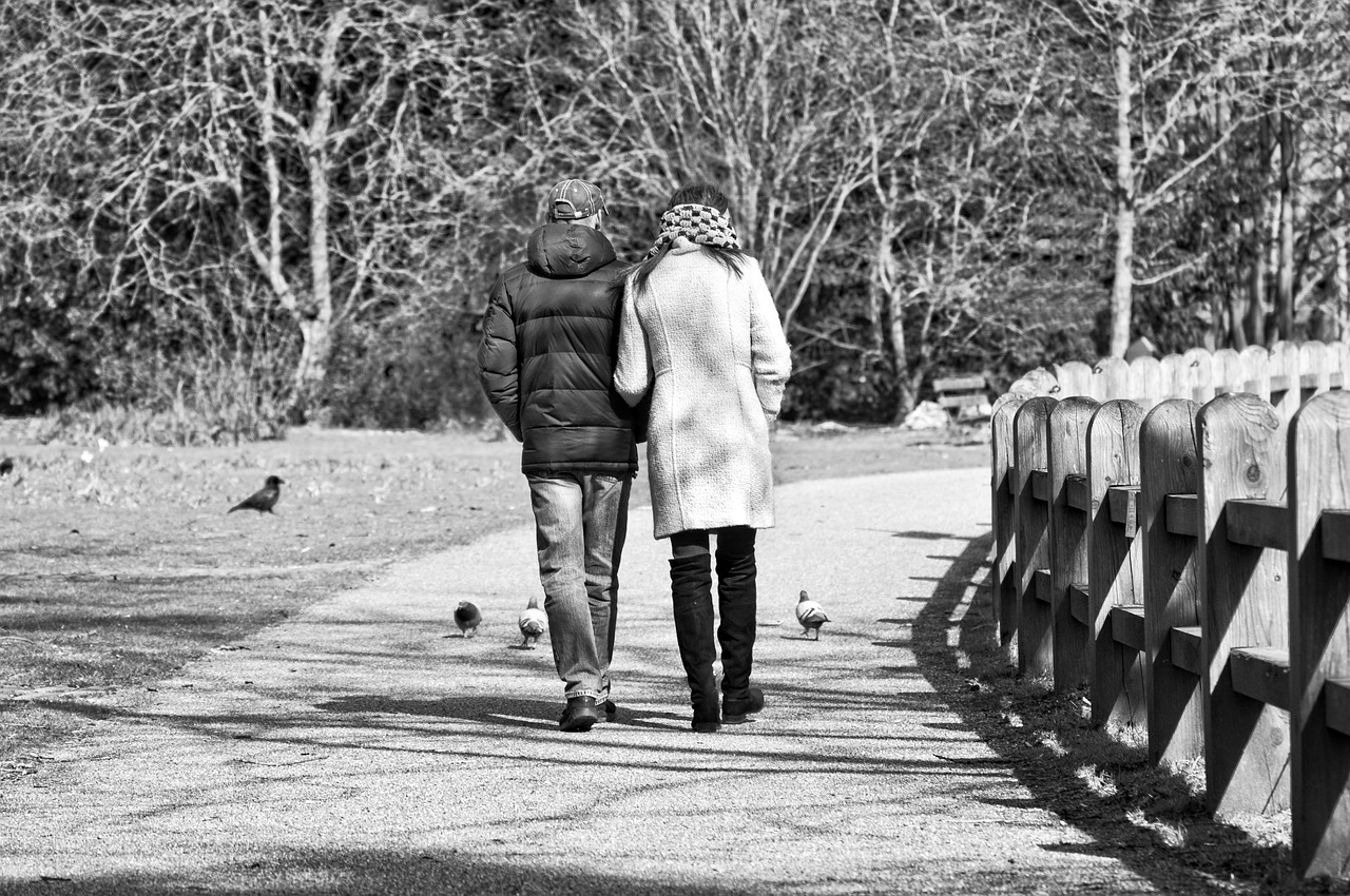 Man, woman, person, people, two, couple, together, walking, arm in arm, footpath, park, gray walking, gray park, gray together