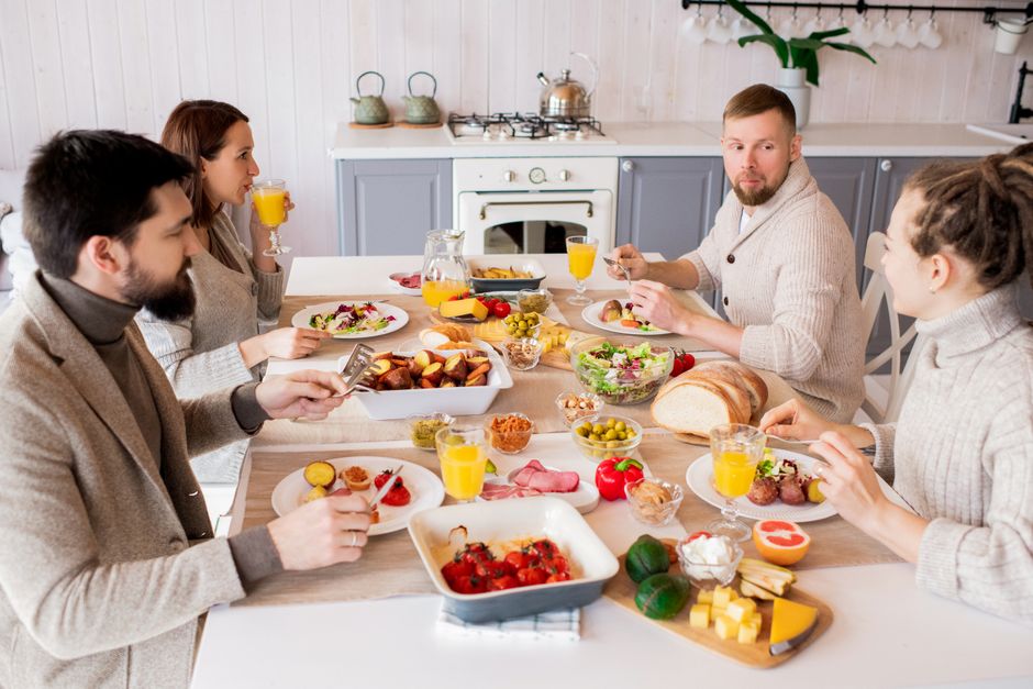 Friends enjoying a healthy breakfast together in a cozy kitchen setting.